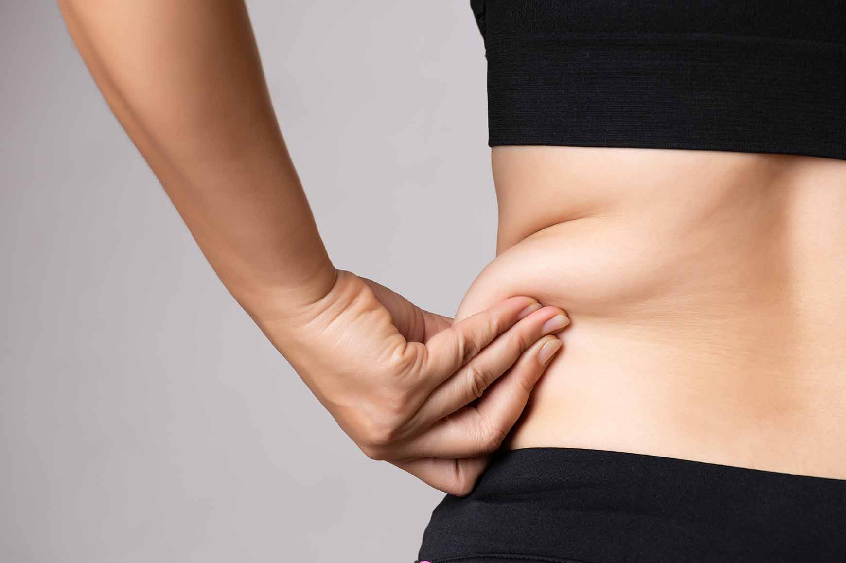 Are you carrying extra weight around your mid-section? A tummy tuck or liposuction may help you get the desired physique.